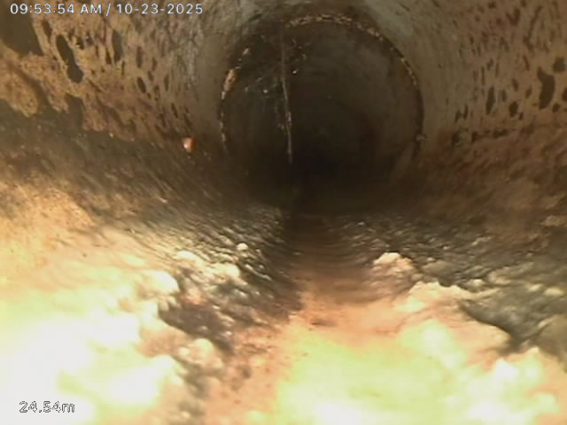 CCTV drain camera image showing grease and fat buildup inside a deteriorated drain pipe in South Auckland at 24.54m